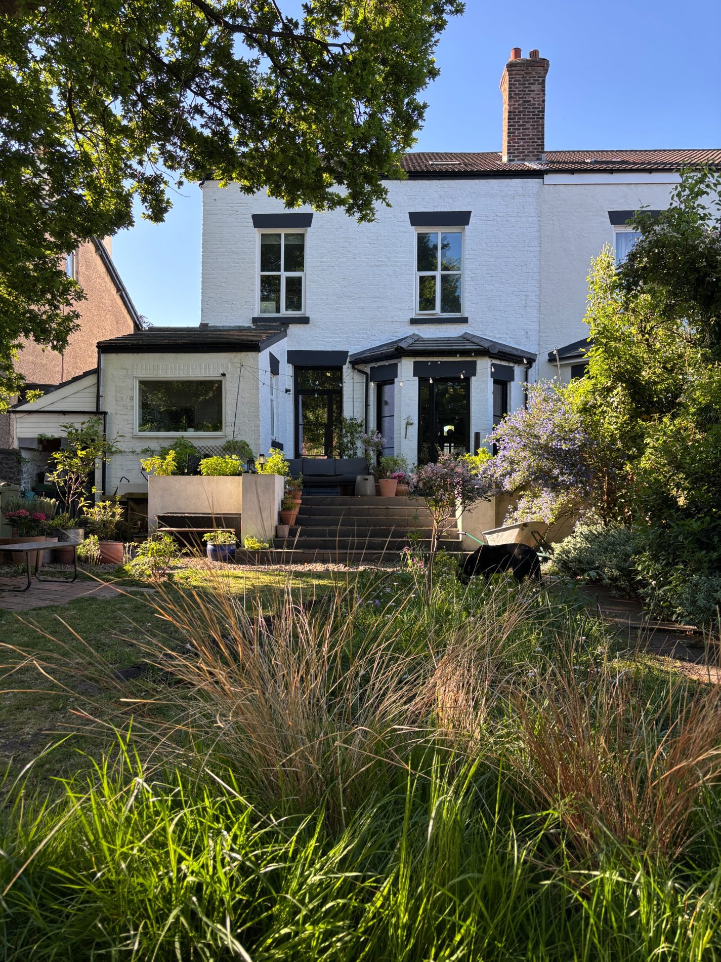 Rear elevation of Stoneycroft Villa seen across the landscaped garden